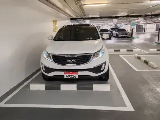 2013 Kia Sportage في Abu Dhabi سيارة مستعملة