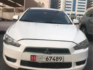 2011 Mitsubishi Lancer في Abu Dhabi سيارة مستعملة