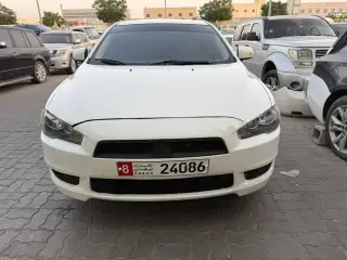 2015 Mitsubishi Lancer في Abu Dhabi سيارة مستعملة